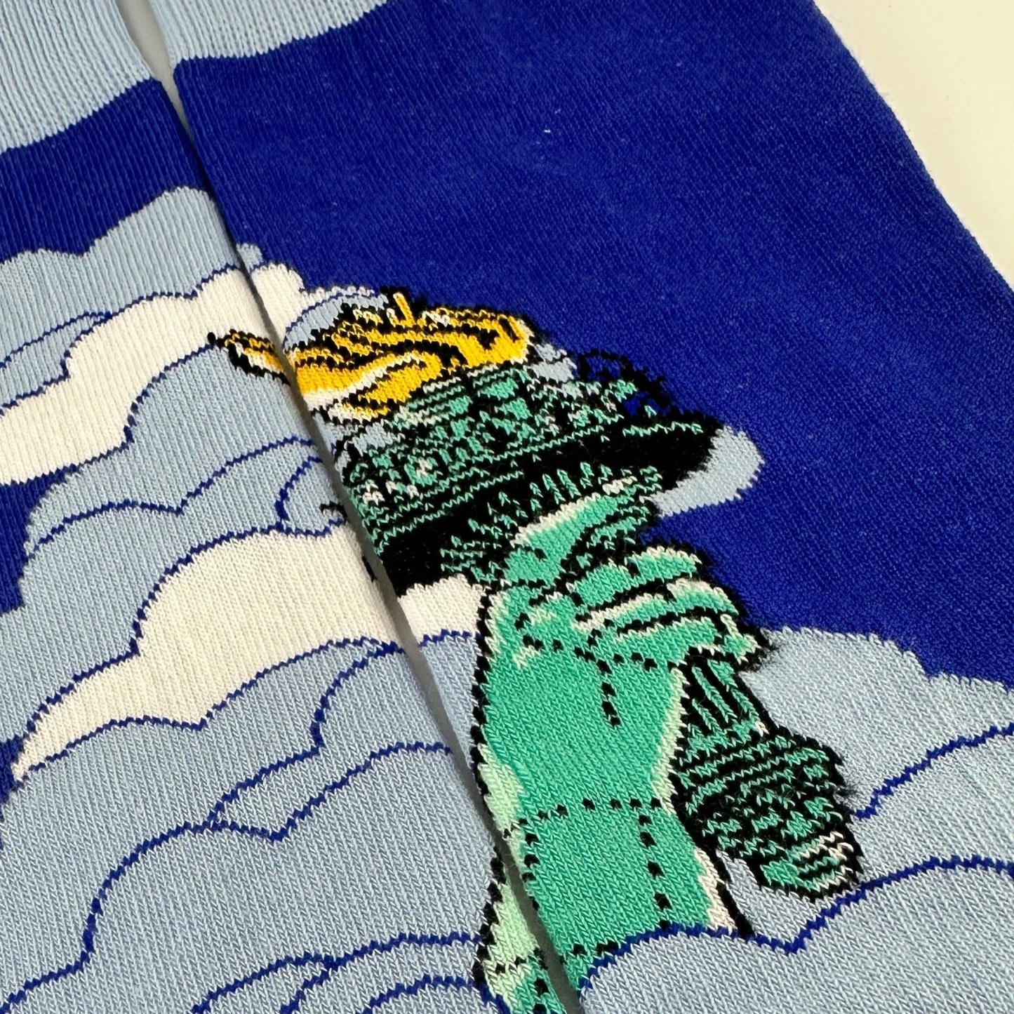 Lady Liberty Rises Above the Clouds Socks from the Sock Panda
